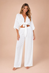 Crop top med knyting og vide bukser