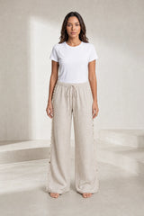 Pantalon large beige à coquillages