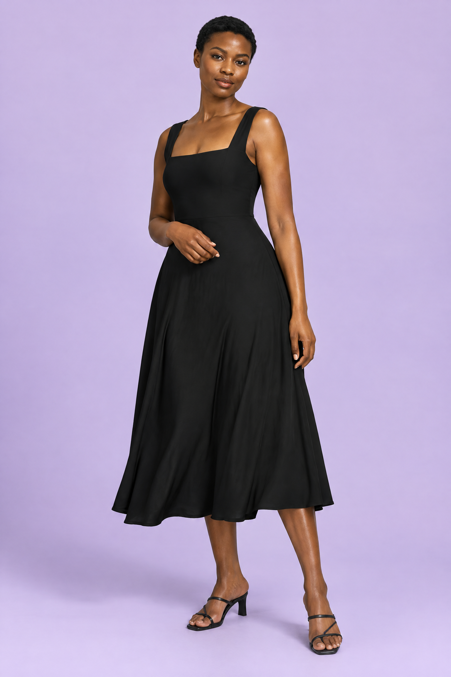 Robe midi noire à fines bretelles et jupe ample | Vue de face | Lounelle Paris